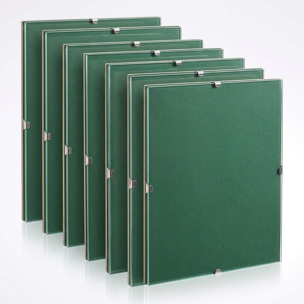 Glass clip frame for pressing leaves flat against photo paper in the sun
