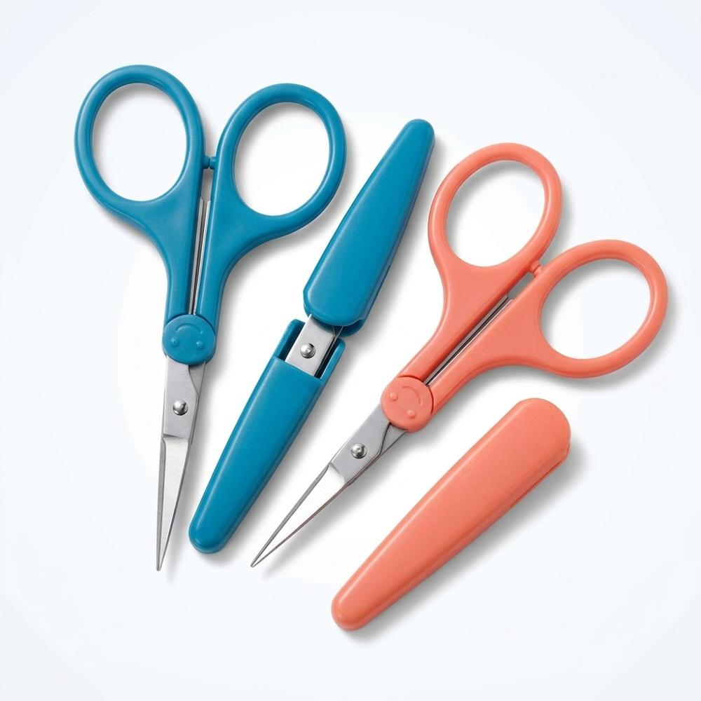fine-tipped detail scissors for cutting shapes out of magazine paper