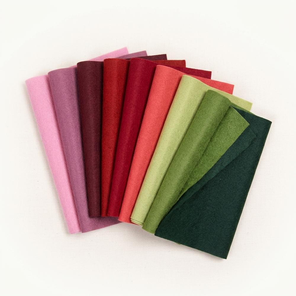 Wool-blend felt sheets in Christmas colors for cutting ornament shapes