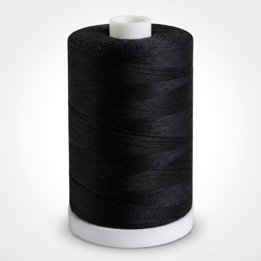 fine black cotton thread on a large spool for dense line work