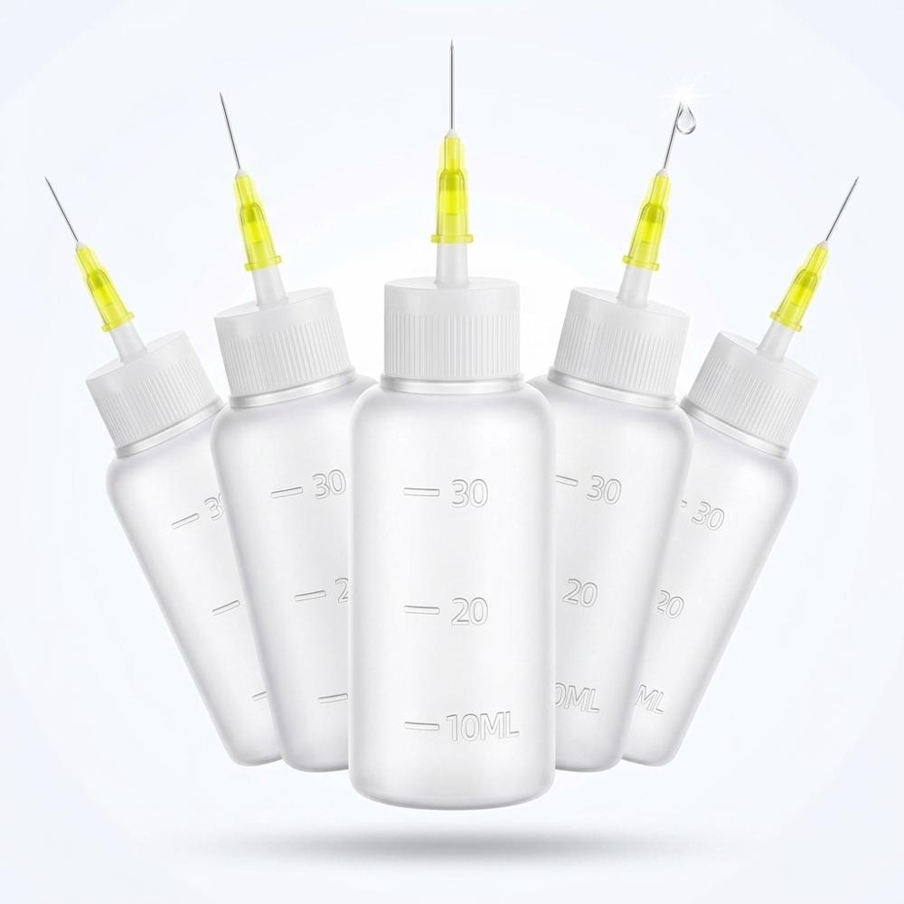 needle-tip squeeze bottles for placing alcohol precisely and mixing custom ink colours