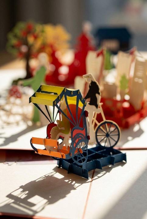 A rickshaw rising off the page