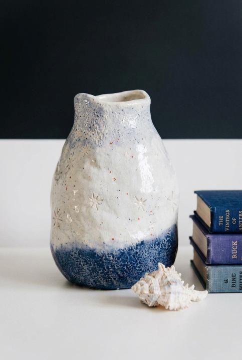 Stars carved into a pinched vase
