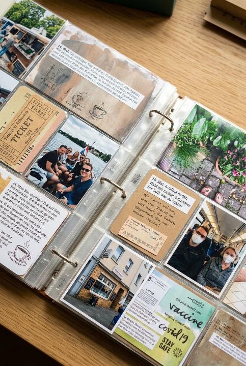 An open pocket-page album