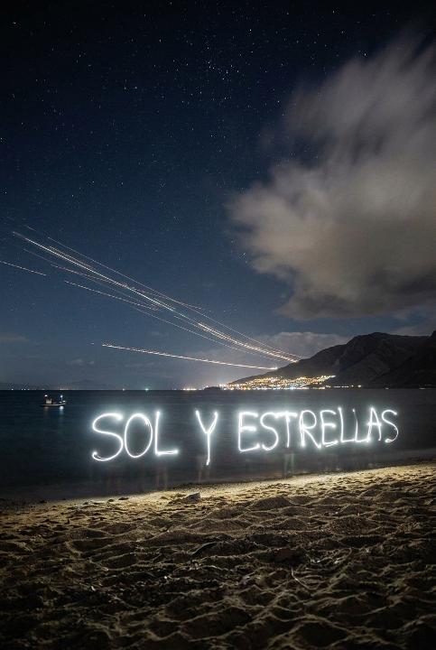 Words written on a dark beach
