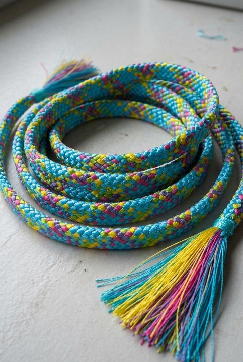 A hand-braided obijime coil