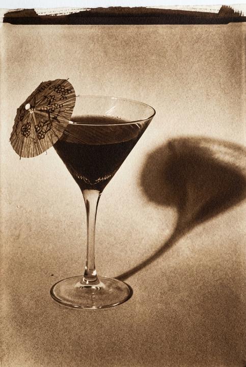 A cocktail glass, sun-printed